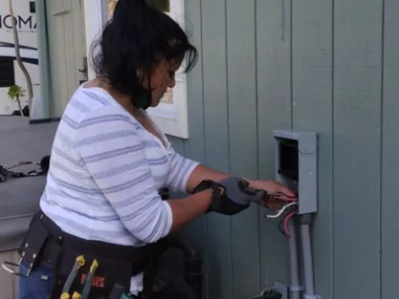 Licensed electrician wiring an exterior subpanel in Mesquite
